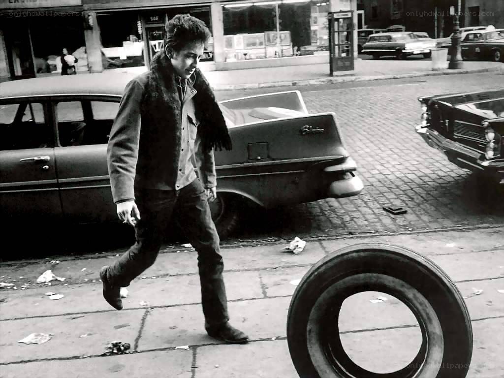 Bob Dylan walking on a city street
