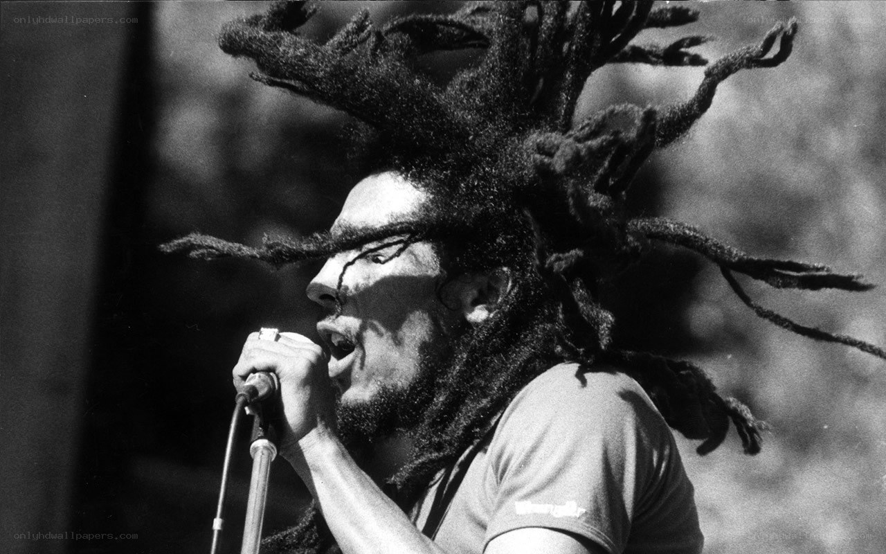 Bob Marley singing into microphone