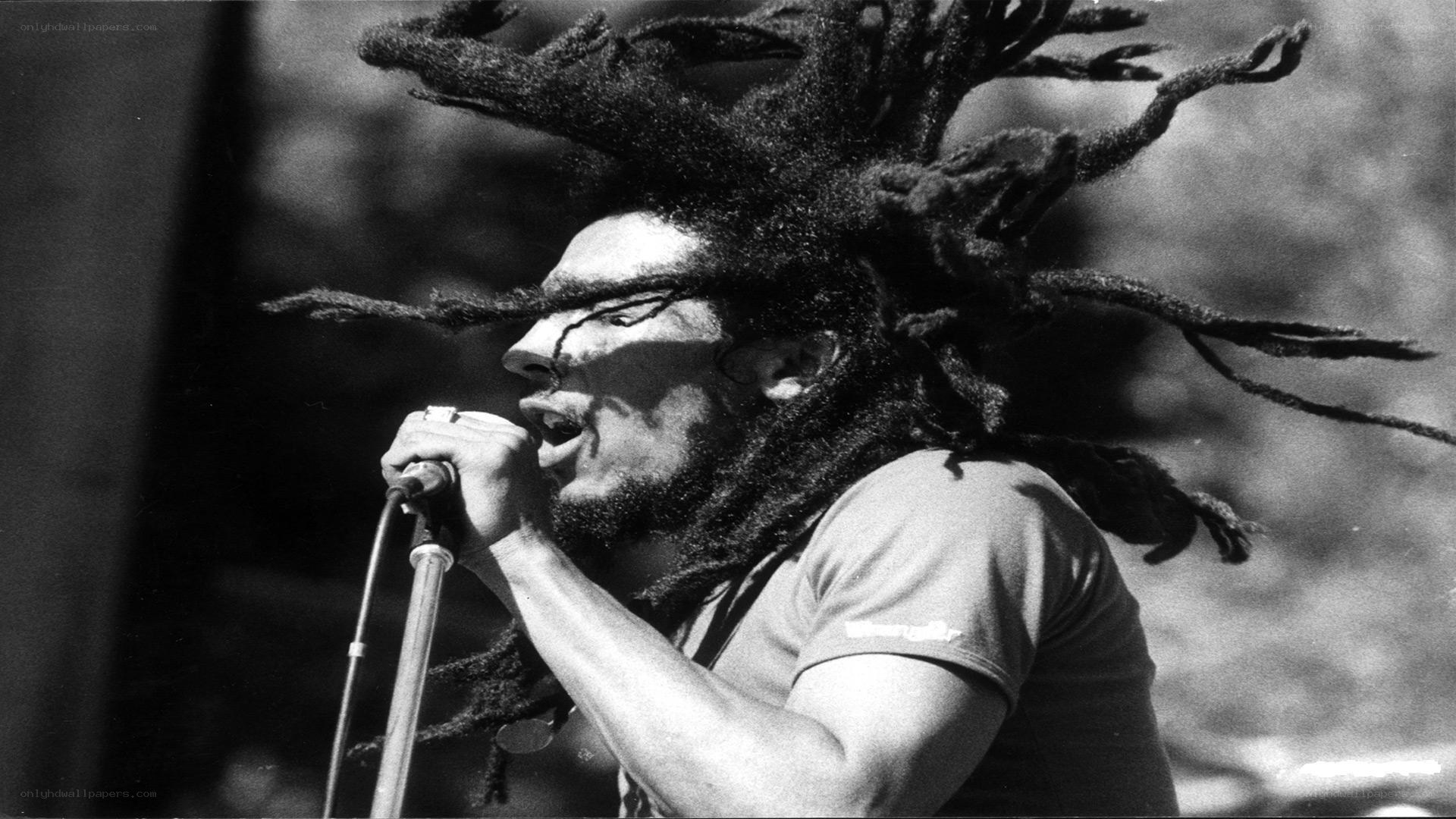 Bob Marley singing into microphone