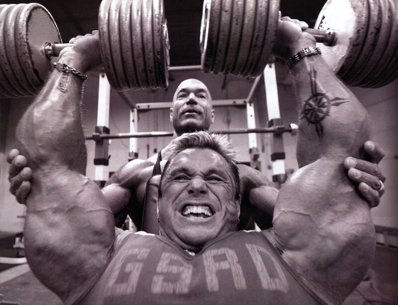 Bodybuilders Lifting Weights