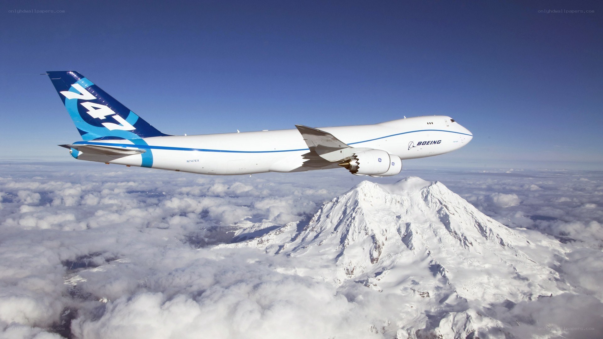 Boeing 747 flying over mountain