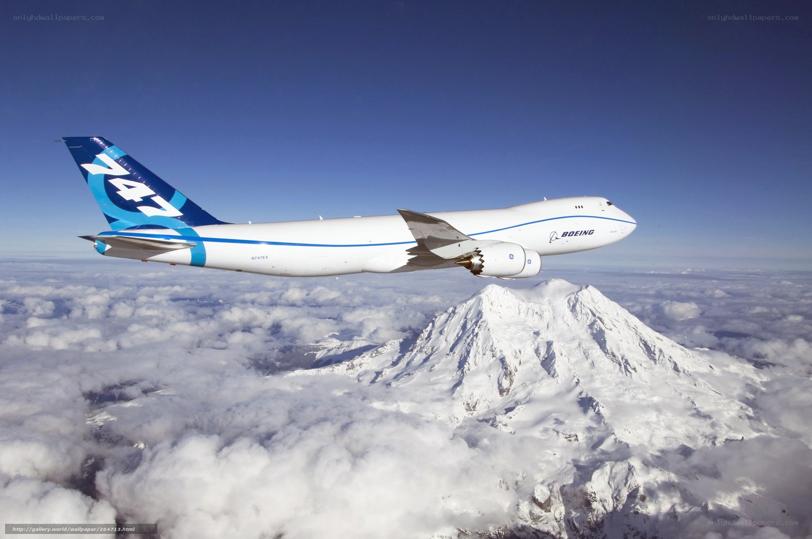 Boeing 747 flying over mountain