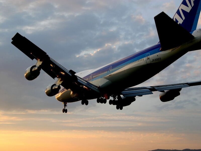 Boeing 747 taking off at sunset