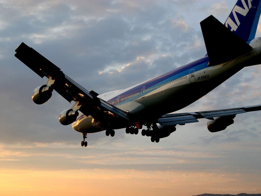 Boeing 747 taking off at sunset