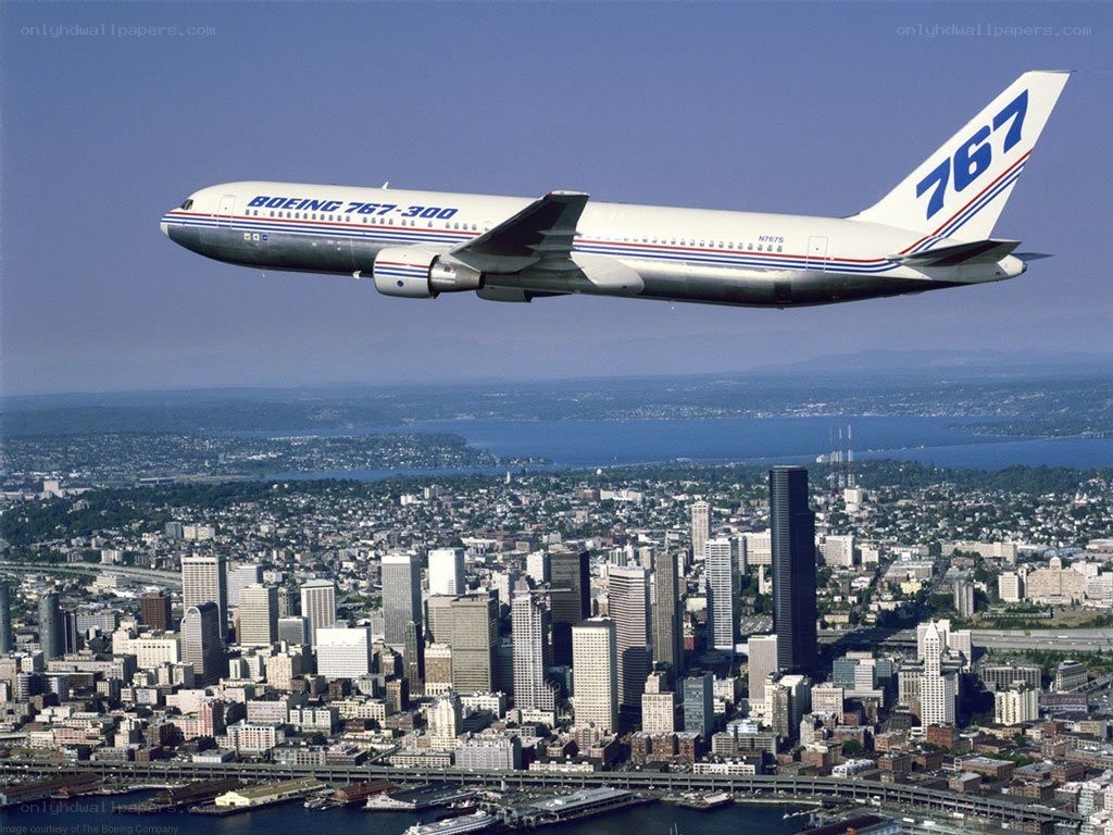Boeing 767-300 over city