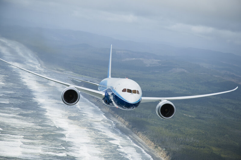 Boeing 787 flying over coast