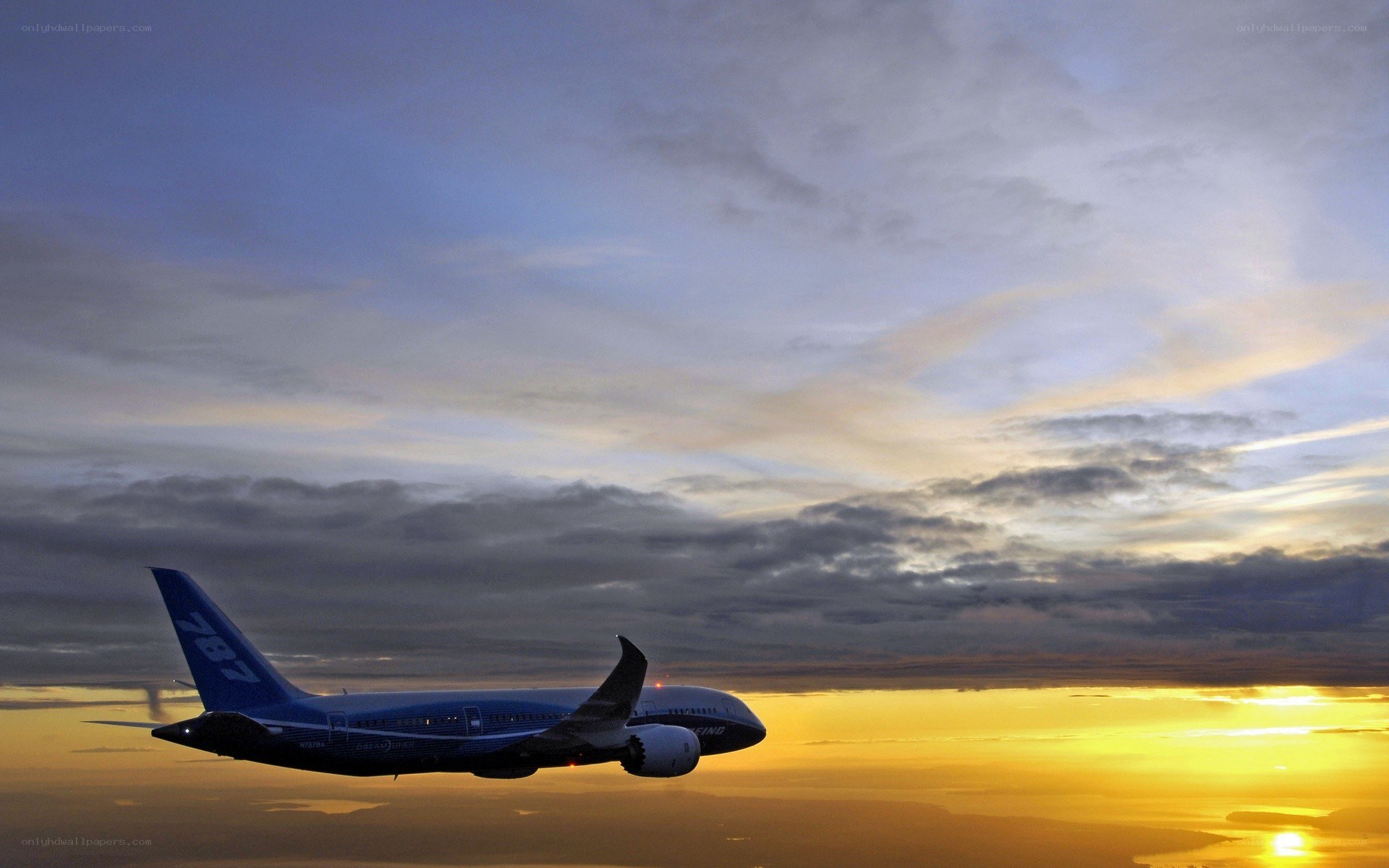 Boeing 787 in sunset sky