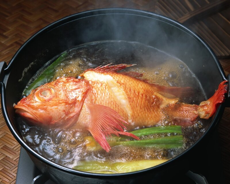 Boiling fish in a pot