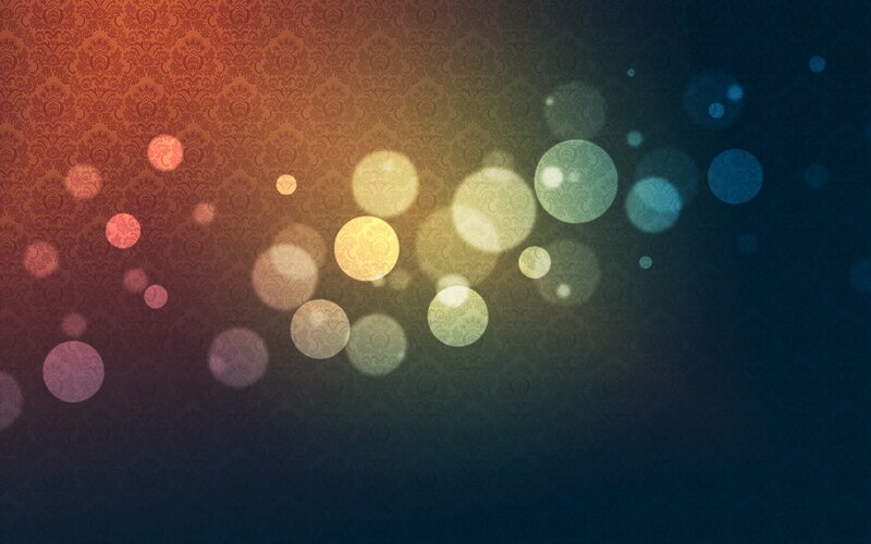 Bokeh Lights on Patterned Background — Orange