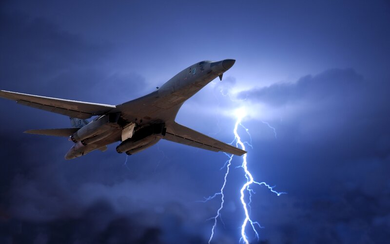 Bomber aircraft in stormy sky