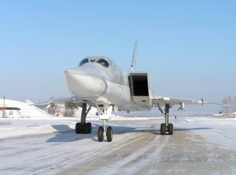 Bomber aircraft on snowy tarmac