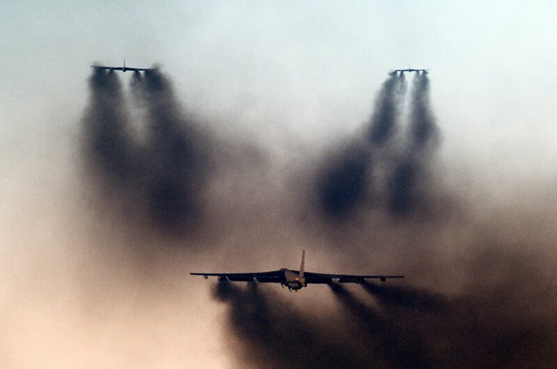Bombers releasing smoke in formation