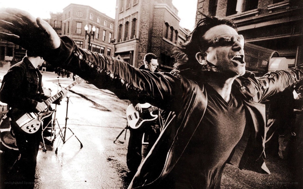 Bono performing on a city street