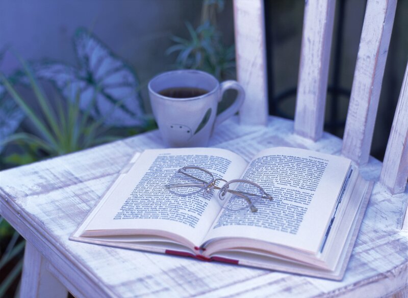 book and coffee on a chair