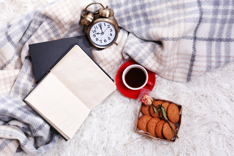 Book and Coffee on Blanket