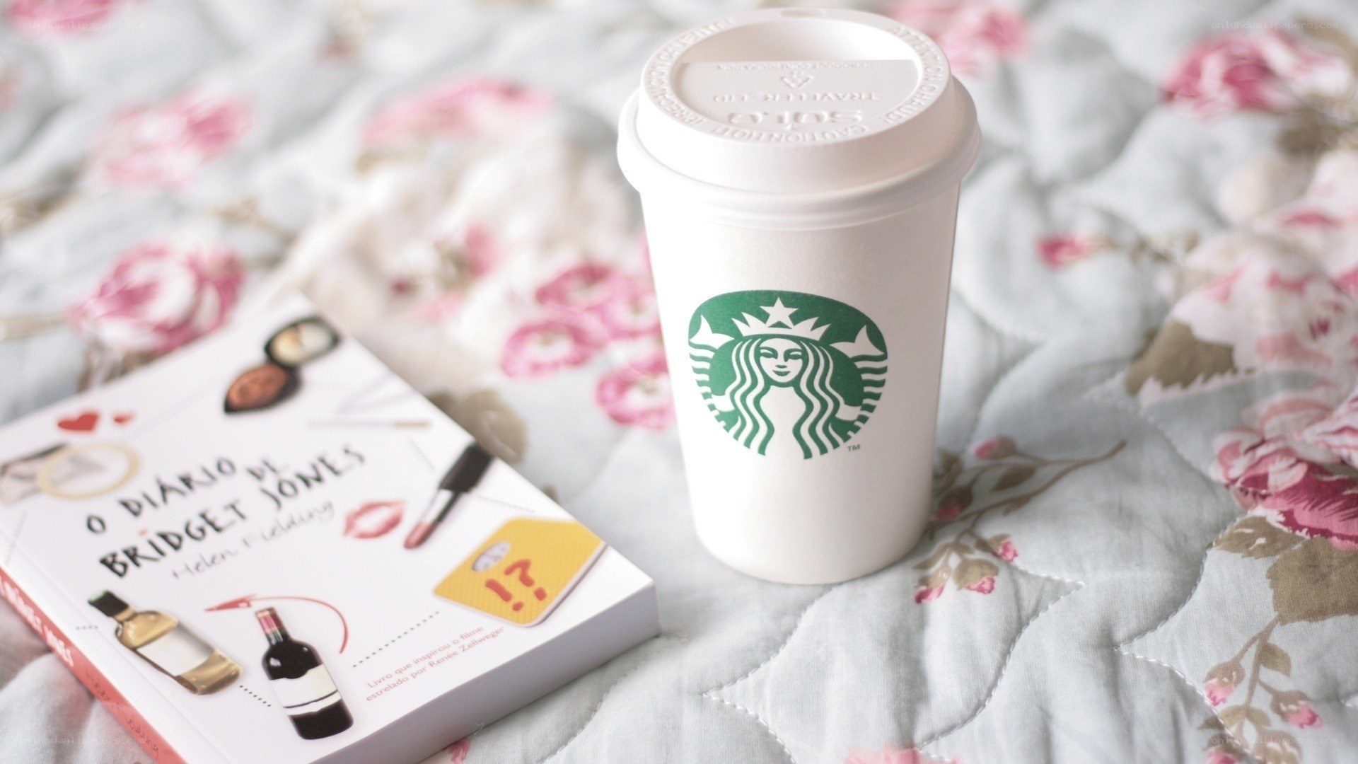 Book and coffee on floral bed