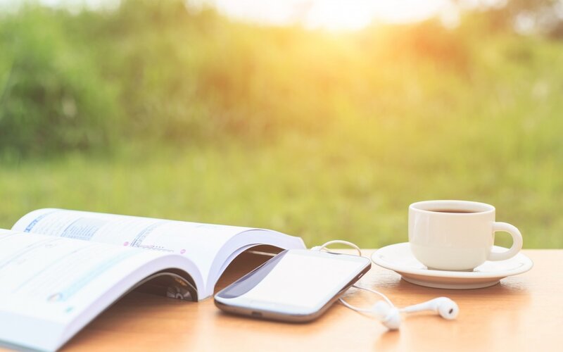 Book and Coffee on Table