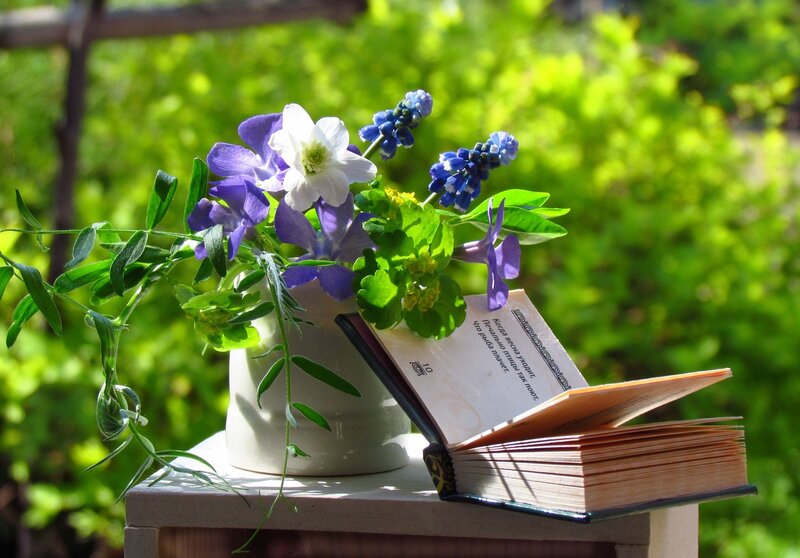 Book and Flowers on Table — Green