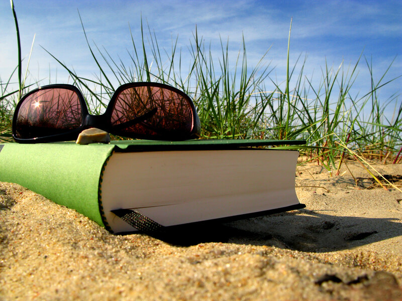 Book and Sunglasses on Sand — Green