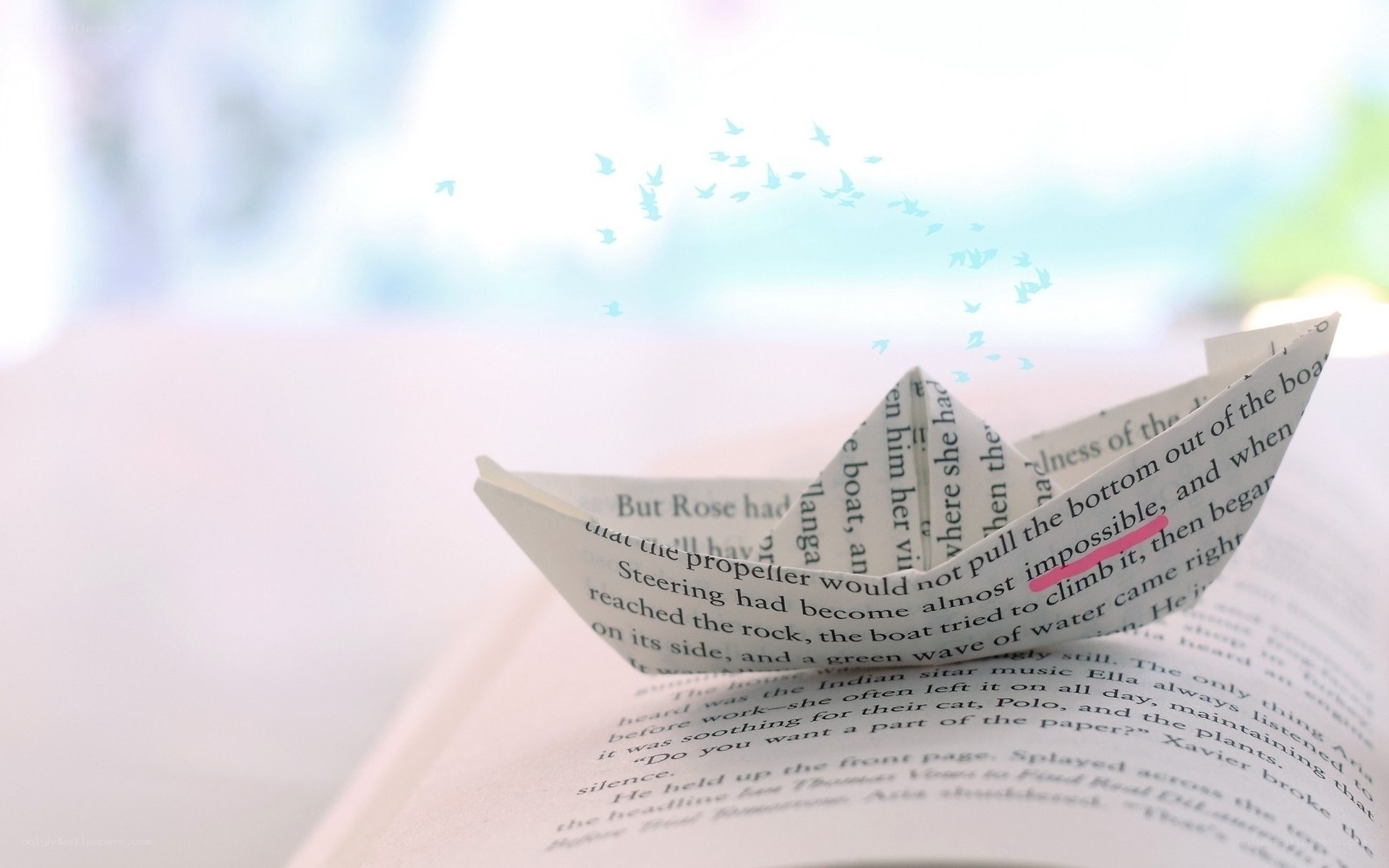 book page with paper boat