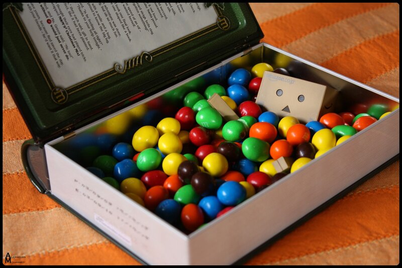 Book-shaped M&M's box with cardboard robot