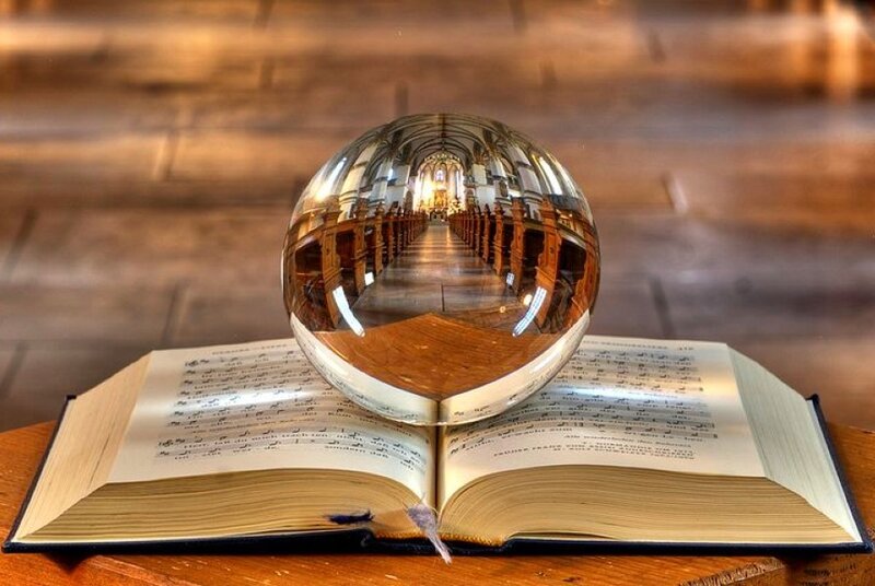 Book with crystal ball reflection