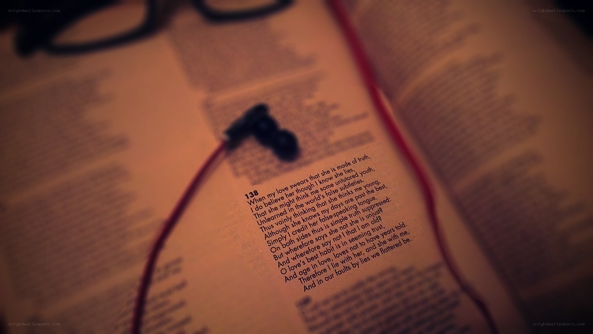 book with earbuds on page