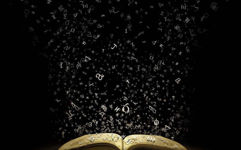 book with floating symbols