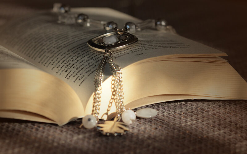 Book with Necklace on Pages