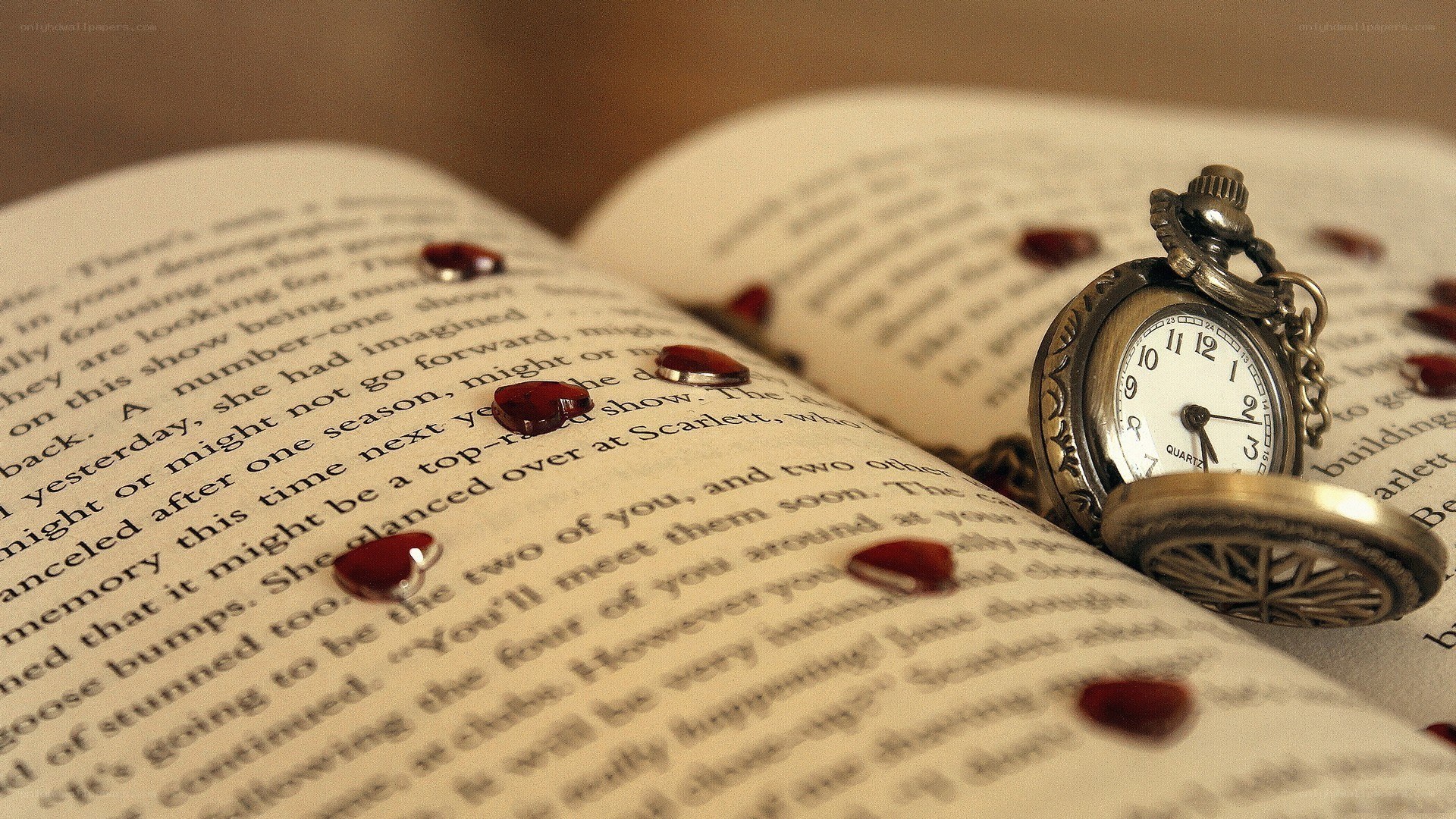 book with pocket watch and hearts