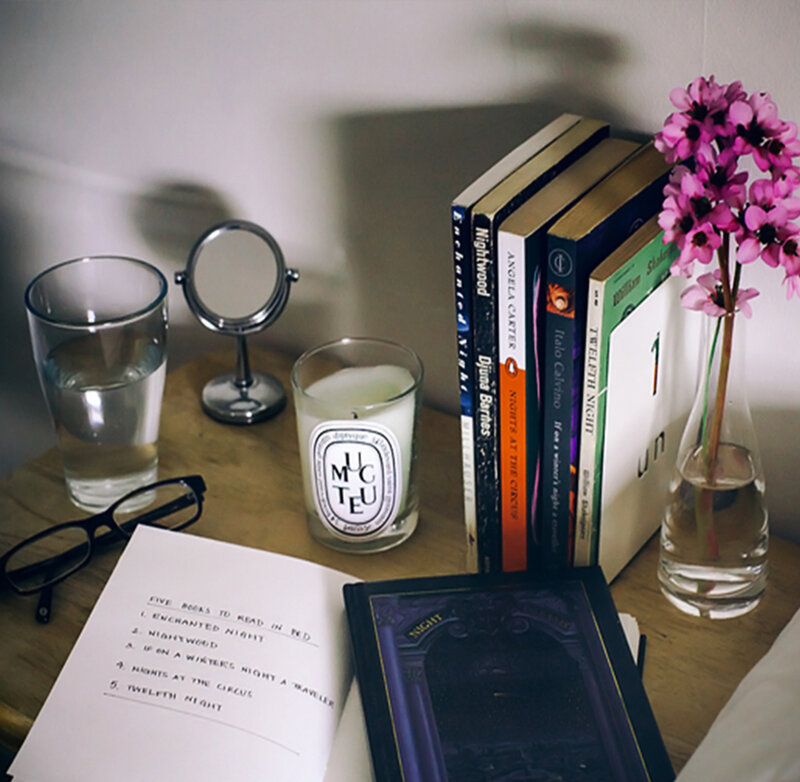 Books and Candle on Table
