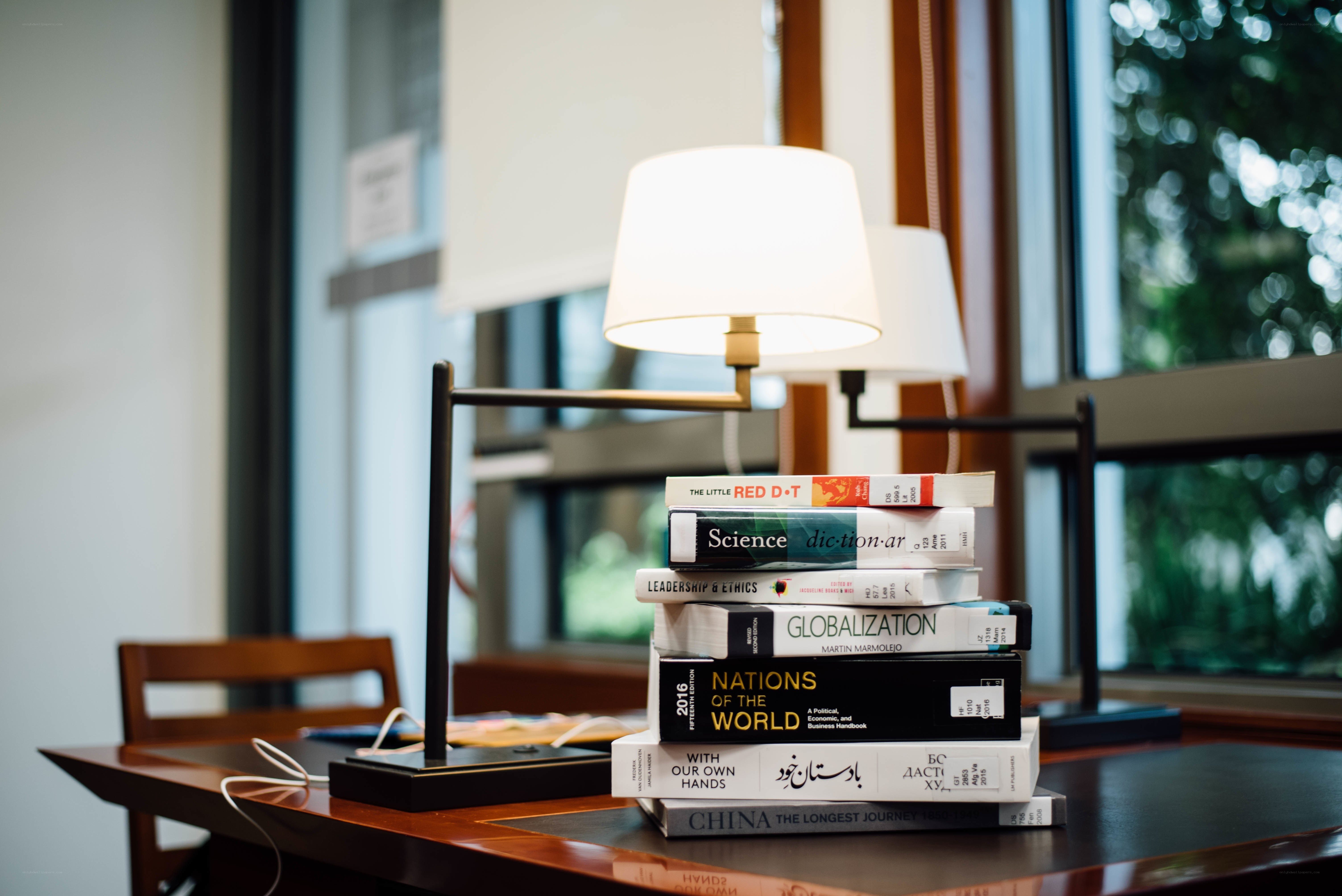 Books and lamp on a desk