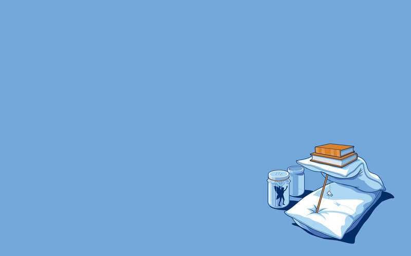 Books and pillows on blue