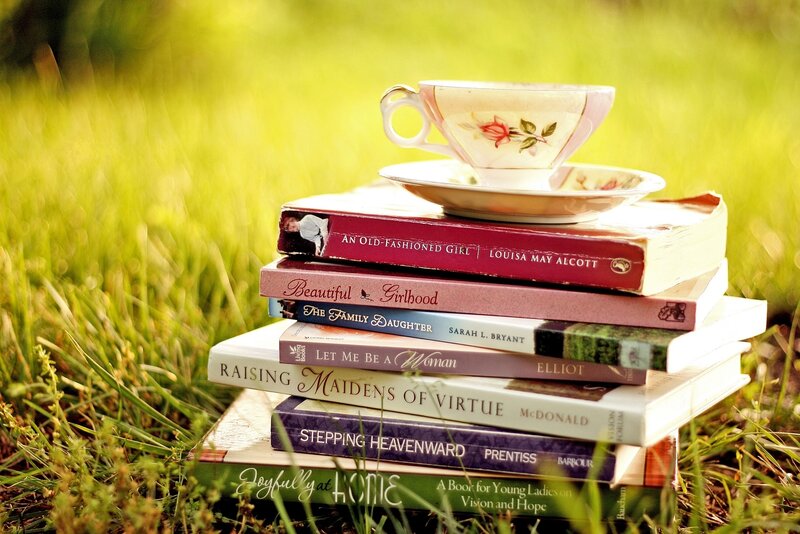 Books and tea in the grass