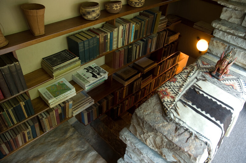 bookshelf with stone bench