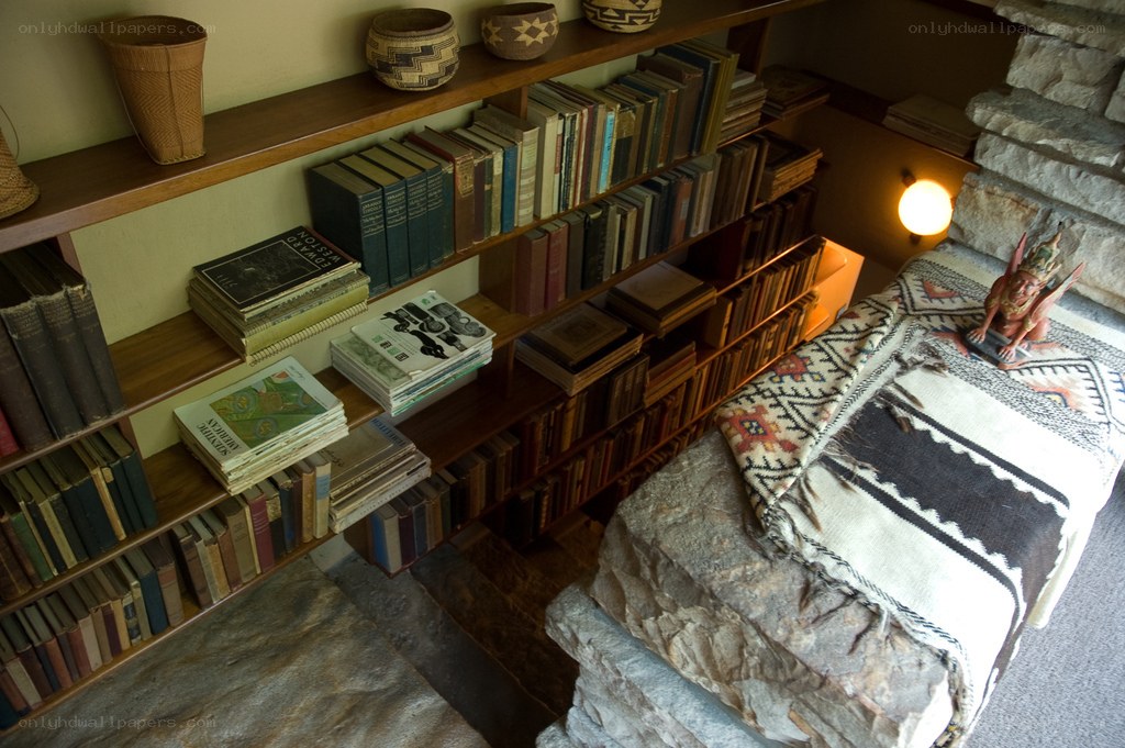 bookshelf with stone bench