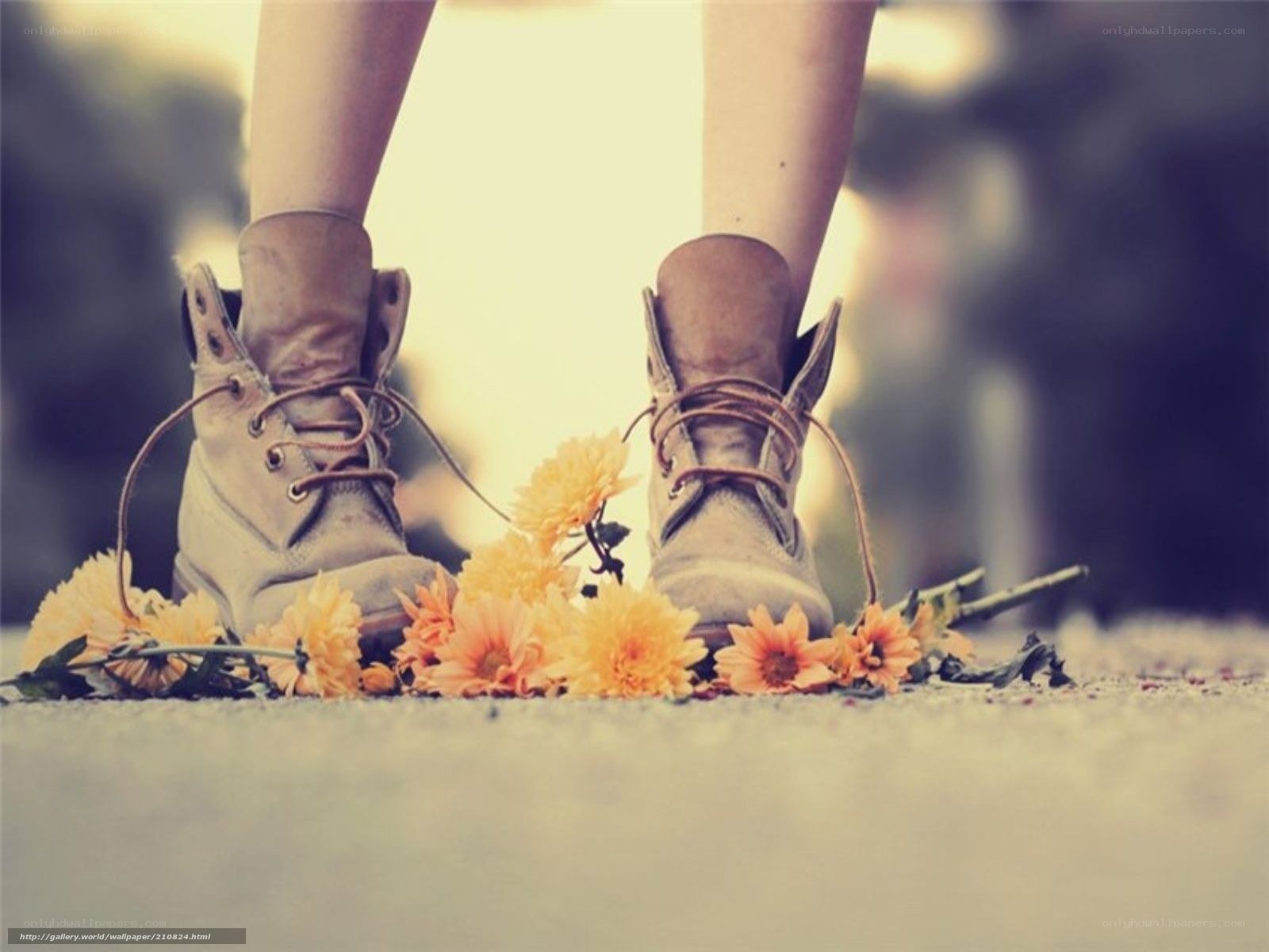 boots and flowers on pavement