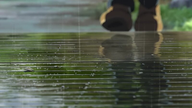 Boots in Rain Puddle