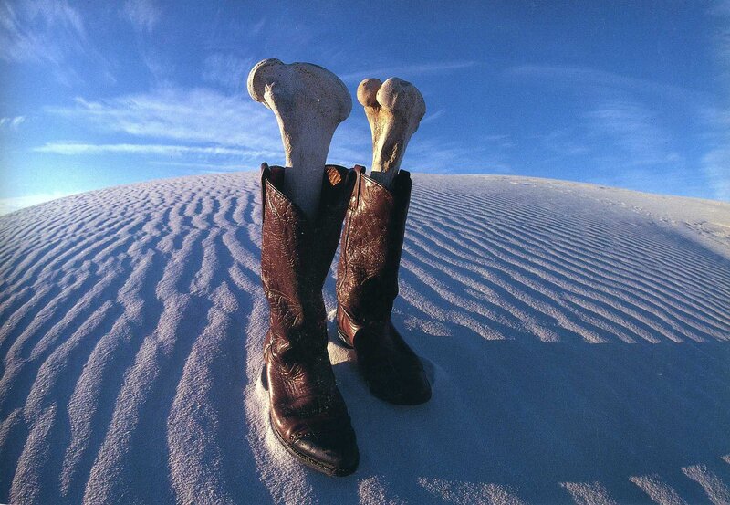 Boots with bones in desert