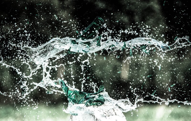 Bottle shattering in water