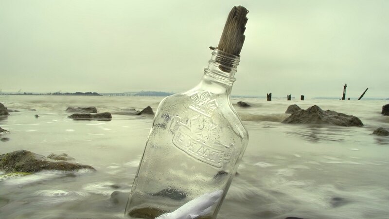 bottle with message on beach