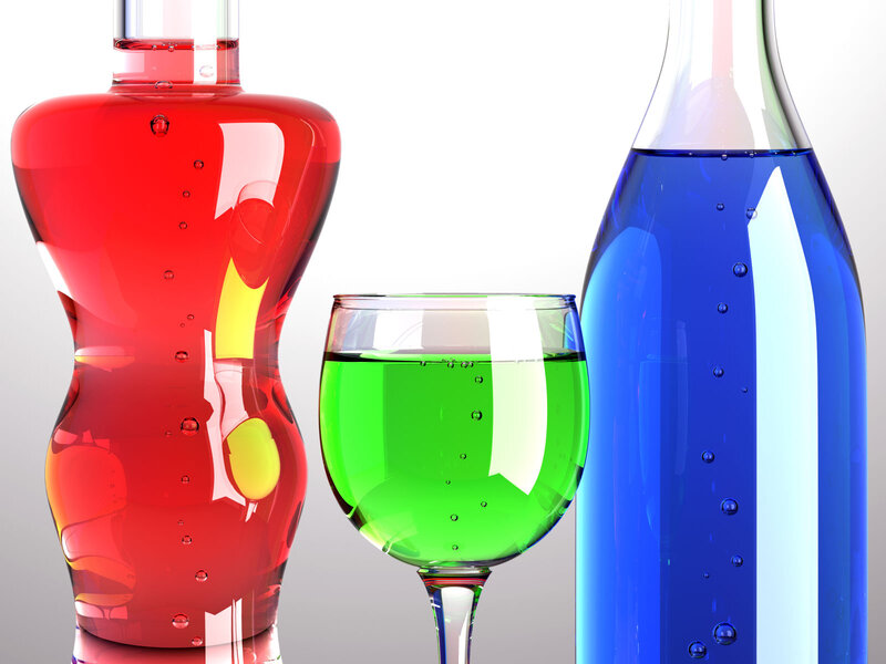 Bottles and Glass of Liquid