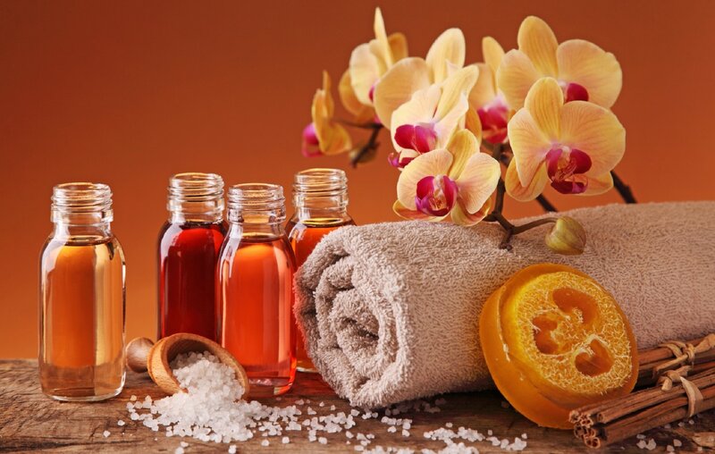 Bottles and Orchid on Towel