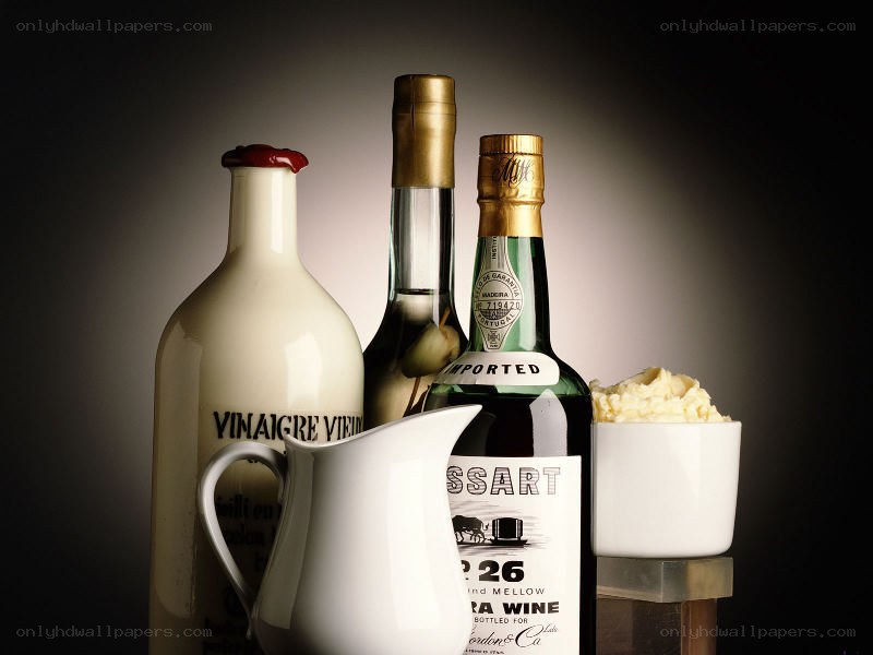 bottles and pitcher of condiments