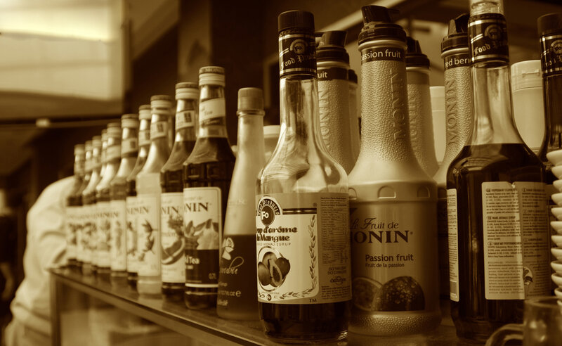 Bottles of Syrup on Shelf