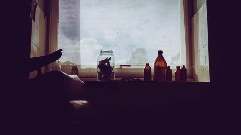 Bottles on Windowsill — Brown