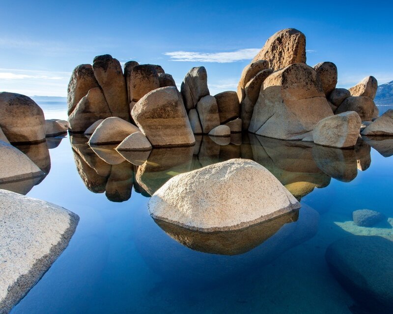 Boulders in clear blue water