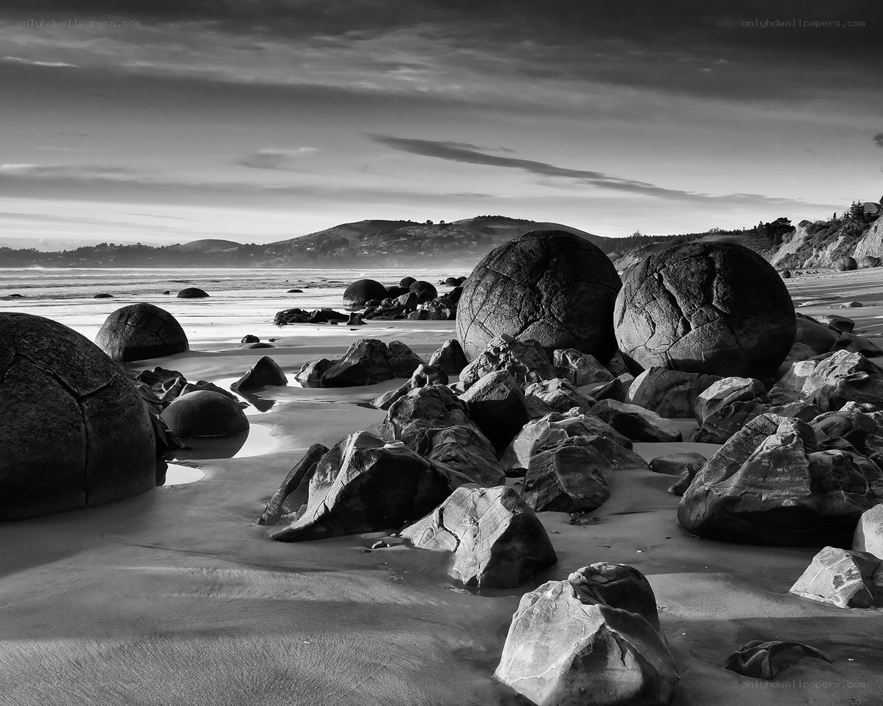 Boulders on a beach at dawn