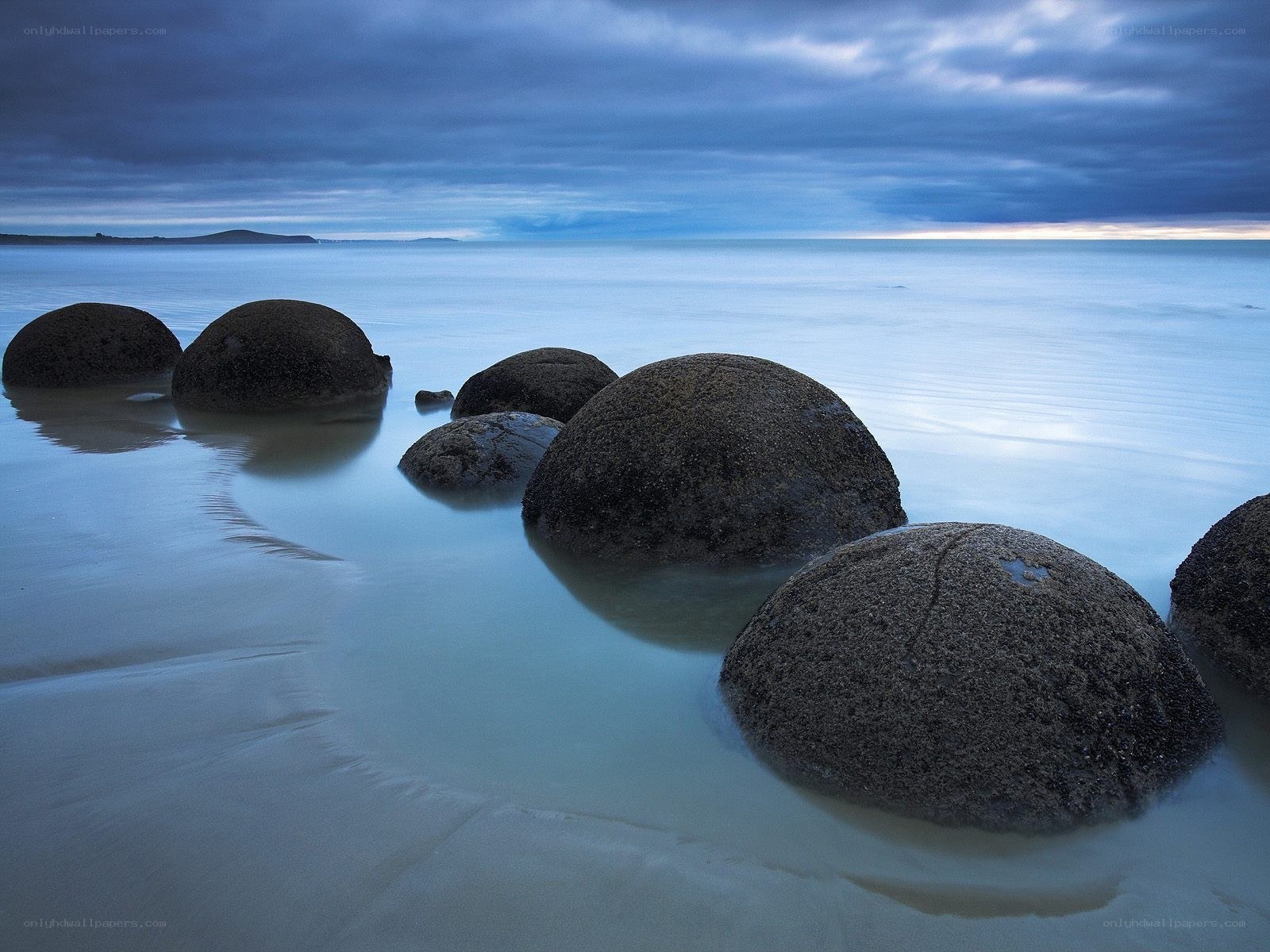 Boulders on a calm beach