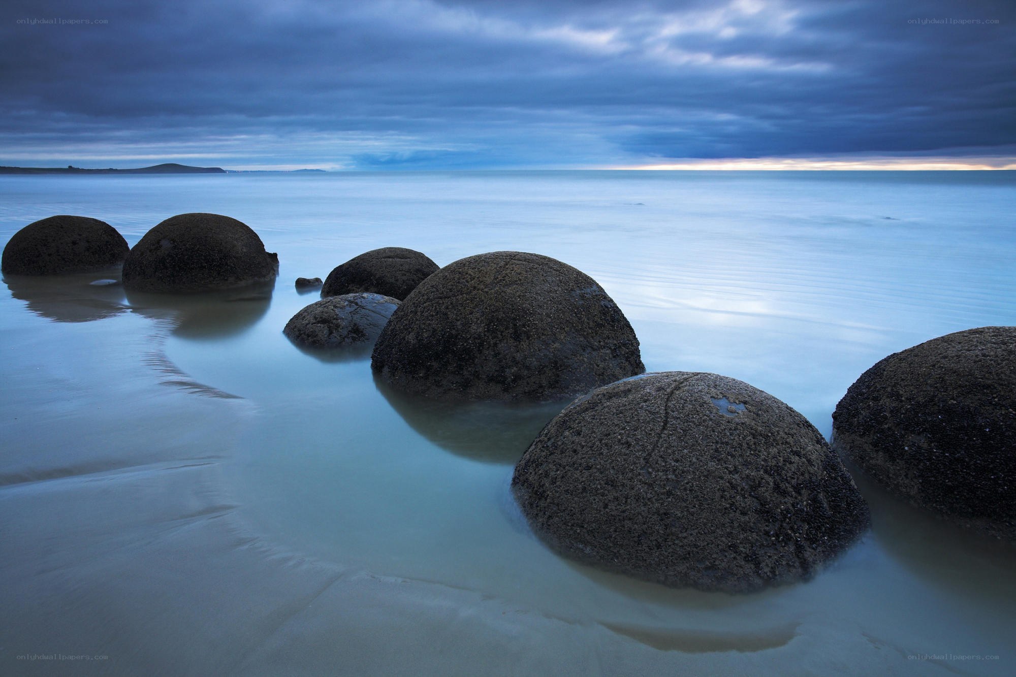Boulders on a calm beach
